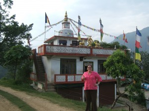 Crystal standing in front of the Buddhist Monastery in Besishar, Nepal.