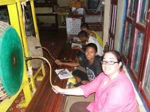 Crystal playing the drums with Buddhist monks