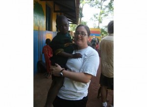 Crystal with an orphan boy in Jinja, Uganda.