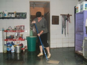 Crystal cleaning the clinic at AWARE. Guatemala.