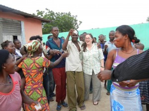 Crystal handing out condoms to villagers in Ghana.