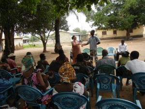 Crystal giving an HIV/AIDS presentation to villagers in Ghana.